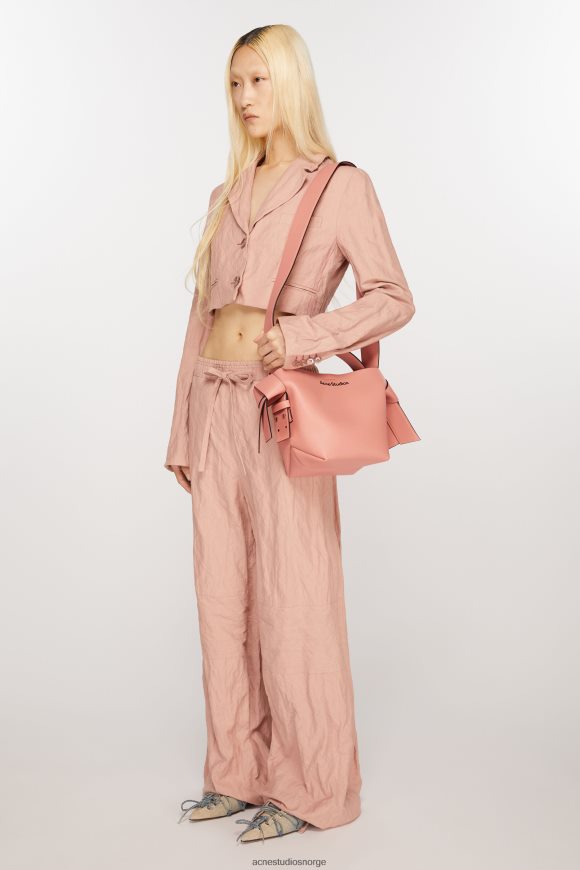 Acne Studios musubi mini skulderveske N2PP4F858 tilbehør lakserosa