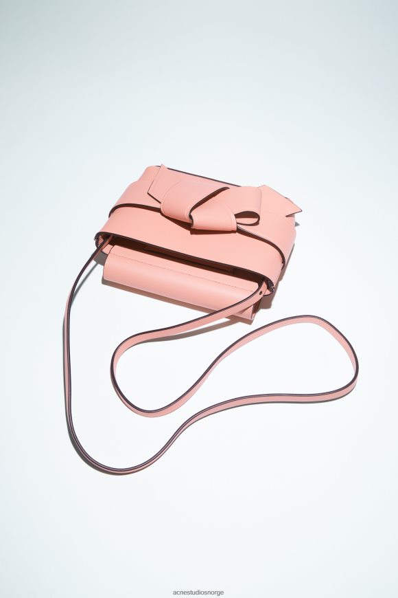 Acne Studios musubi mini crossbody-veske N2PP4F865 tilbehør lakserosa